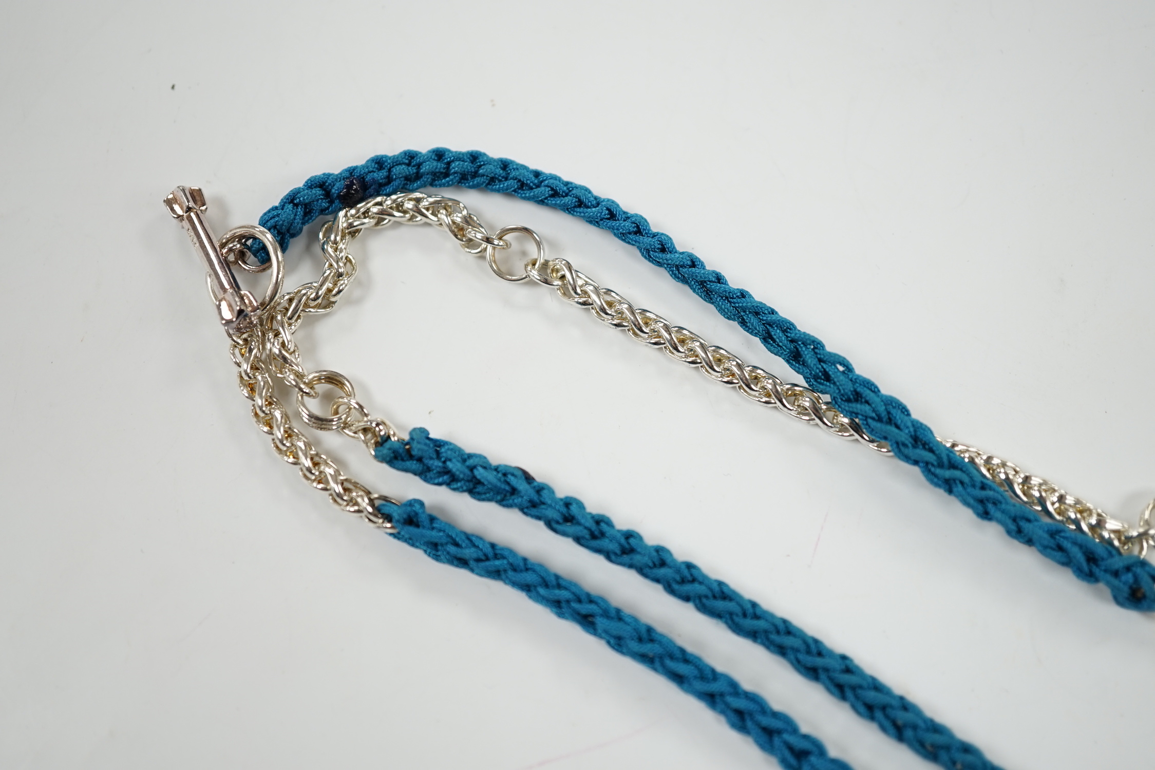 A modern Links of London, silver skull and heart pendant, 14mm, on a Links of London, silver link and rope twist thread chain, 90cm, in a Links of London box.